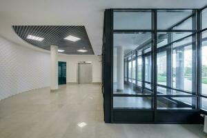 empty modern hall room with columns, doors and panoramic windows. photo