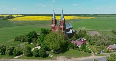 aerial view on old new red bricks gothic temple or catholic church in countryside video