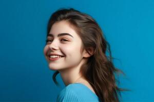Profile side view portrait of attractive cheerful girl demonstrating copy space ad new isolated over bright blue color background, photo