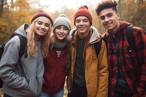 Portrait Of Smiling Young Friends Hiking Outdoors Together photo