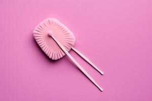Reusable silicone swab on pink background. Alternative to cotton buds flat lay top view. Eco friendly sustainable life style concept illustration photo