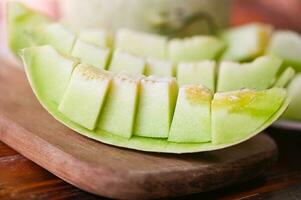 cantaloupe thai slice fruit for health green cantaloupe thailand, cantaloupe melon on wooden plate photo