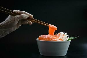 salmon sashimi food salmon fillet japanese menu with hands were holding the chopsticks to hold the salmon sashimi, fresh raw salmon fish for cooking food seafood fish photo