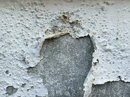 Old concrete cracked wall texture photo