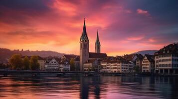 The church Grossmunster. Switzerland. Cityscape image of Zurich with colorful sky, during dramatic sunset, photo