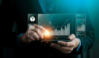 Businessman analyzing business enterprise data management, Business analytics with charts, metrics and KPIs to performance organization. Corporate strategy for finance, operations, sales, marketing photo