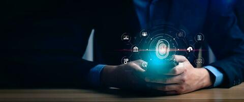 Businessman using fingerprint to access personal financial information, biosecurity. Cybersecurity and hacker protection technology, identity verification, digital financial information photo