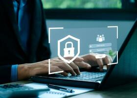 cybersecurity concept Businessmen protecting personal data on laptops and virtual interfaces. Lock icon and internet network security technology. Username and password photo
