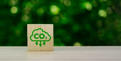 CO2 emission reduction concept, businessman with environmental technology Icons, global warming, sustainable development, renewable energy business. climate change, carbon capture, storage, reuse photo