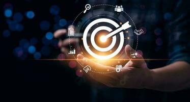Business goals and marketing strategies. Businessman selecting target icon on laptop. economic analysis, Company strategy development, Manage and solve problems, success. business background photo