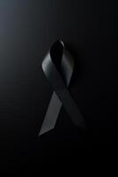 Black mourning ribbon with a dark background. photo