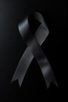 Black mourning ribbon with a dark background. photo