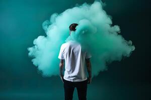 a man standing in front of a cloud of smoke with the cyan theme. photo