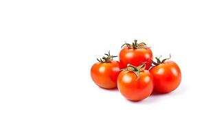 A group of fresh whole red tomatoes isolated on white background with copy space. photo
