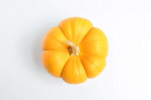 Top view of fresh orange pumpkin isolated on white background. photo