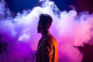 a man standing in front of a cloud of smoke with neon lights. photo