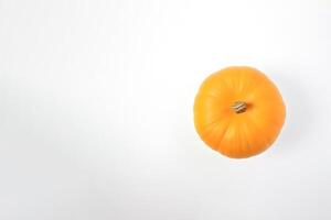 Top view of fresh orange pumpkin isolated on white background. photo