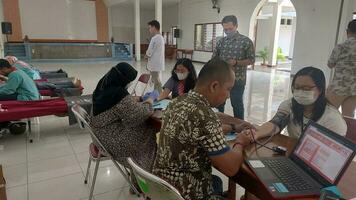 Magelang, Central Java, Indonesia, May 16, 2023, Blood donation activities. Personal data screening and health check before donating blood. For social activities. Help people. For body health photo