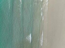 Aerial drone view of beautiful beach with turquoise sea water of Gulf of Thailand. Kood island, Thailand photo