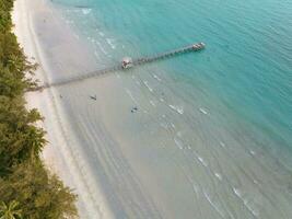 Aerial drone view of beautiful beach with turquoise sea water and palm trees of Gulf of Thailand. Kood island, Thailand photo