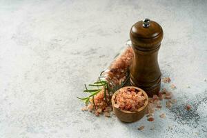 Himalayan pink salt is herb seasoning isolated on white abstract background with copy space photo