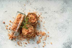Himalayan pink salt is herb seasoning isolated on white abstract background with copy space photo