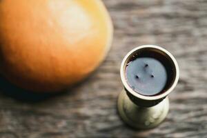 Concept of Eucharist or holy communion of Christianity. Eucharist is sacrament instituted by Jesus. during last supper with disciples. Bread and wine is body and blood of Jesus Christ of Christians. photo