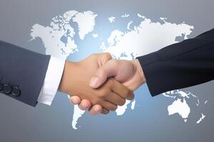 Business agreement handshake hand gesture with a world map in the background. photo