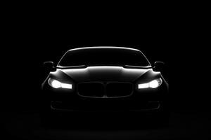 Front view dark silhouette of a modern luxury black car isolated on black background. AI Generated photo