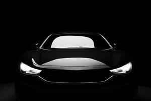 Front view dark silhouette of a modern luxury black car isolated on black background. photo