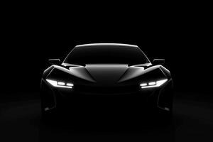 Front view dark silhouette of a modern sport black car isolated on black background. photo