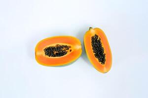 Top view fresh sliced papaya fruits isolated on white background. photo