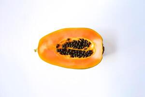 Top view fresh sliced papaya fruit isolated on white background. photo