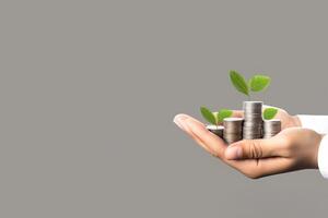 Growth finance concept. Plant growing on the coin in hand for wealth saving money and investment success. photo