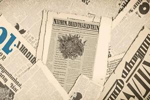 An old vintage newspaper pieces background. photo