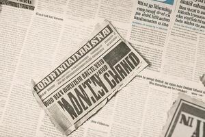 An old vintage newspaper pieces background. photo