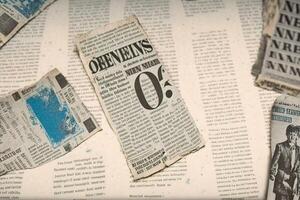 An old vintage newspaper pieces background. photo