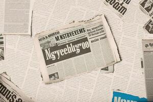 An old vintage newspaper pieces background. photo