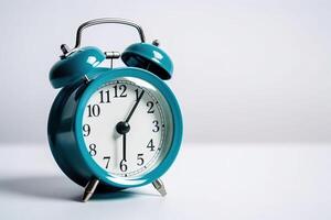 blue alarm clock on a white background. photo