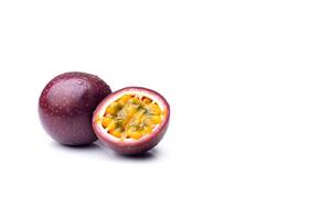 Fresh whole and sliced purple passion fruits isolated on white background with copy space. photo