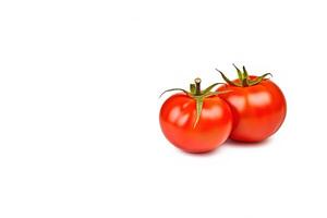 Fresh whole red tomatoes isolated on white background with copy space. photo