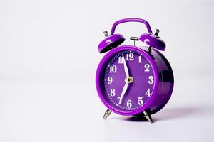 purple alarm clock on a white background. photo