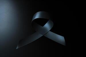 Black mourning ribbon with a dark background. photo