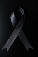 Black mourning ribbon with a dark background. photo