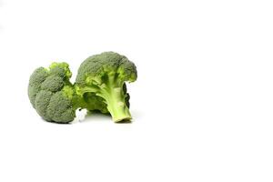 Fresh broccolis isolated on white background with copy space. photo