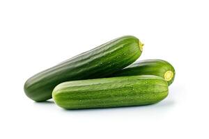 A pile of fresh green cucumbers isolated on white background. photo