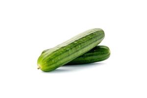 A pile of fresh green cucumbers isolated on white background. photo