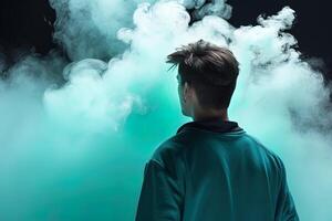 a man standing in front of a cloud of smoke with the cyan theme. photo