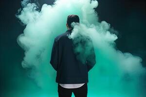 a man standing in front of a cloud of smoke with the cyan theme. photo