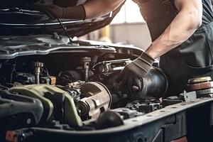 Auto mechanic working on car broken engine in mechanics service or garage. Transport maintenance wrench detia. photo